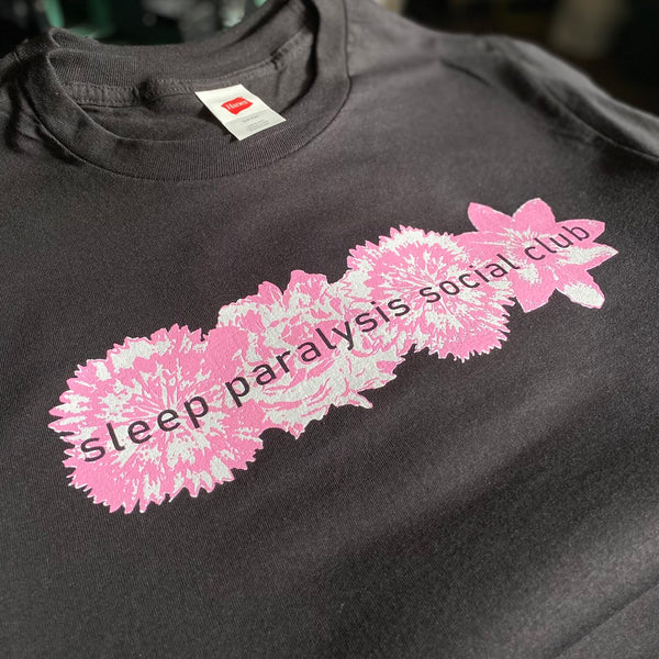 Sleep Paralysis Social Club pink flower design on a black tee at RVA Threads screen printing, Virginia