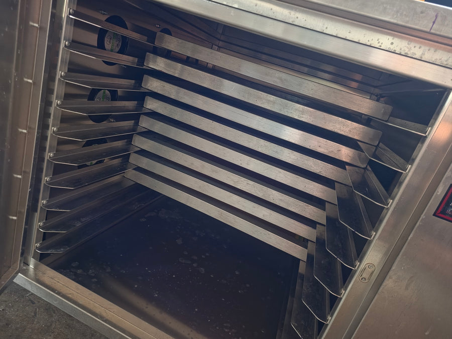Empty racks and circulation fans inside the stainless steel screen drying cabinet at RVA Threads screen printing, Virginia