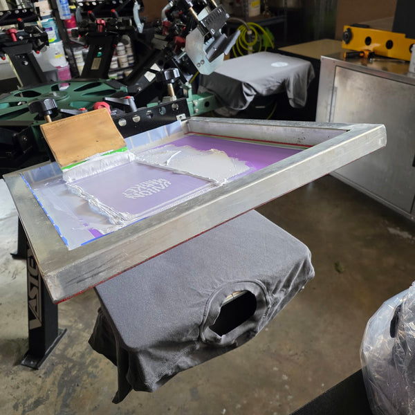 Union Market screen flooded with white ink over a Pepper Comfort Colors 1717 tee on the press at RVA Threads screen printing, Virginia