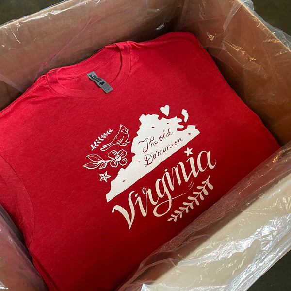 Virginia design tees in white ink on red, folded in a plastic lined box for delivery at RVA Threads screen printing, Virginia