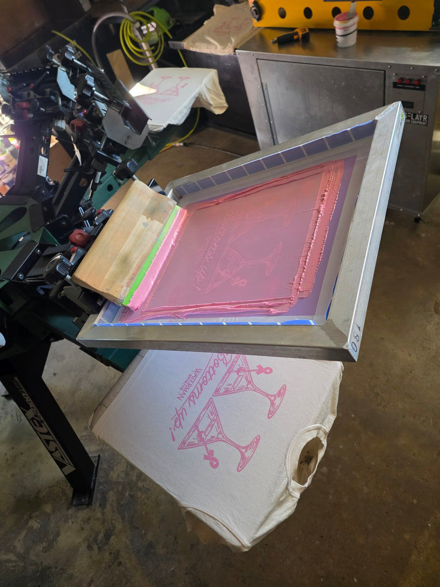Waterman Spirits Bottoms Up screen flooded with pink ink, raised over a printed Ivory Comfort Colors tee at RVA Threads screen printing, Virginia